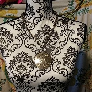 Silver tone medallion necklace